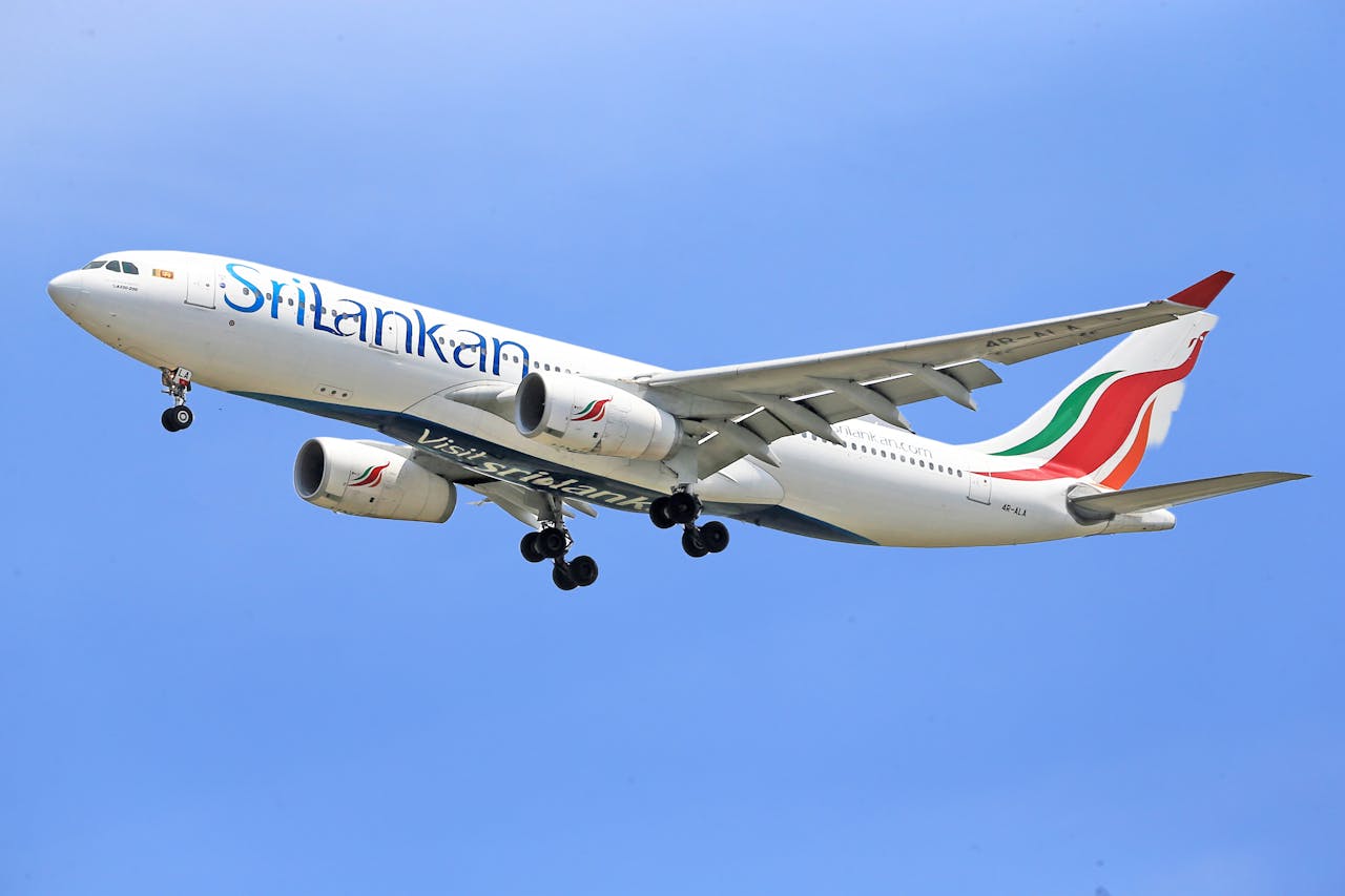 SriLankan Airlines Airbus A330 in clear sky, showcasing modern aviation and airline travel.